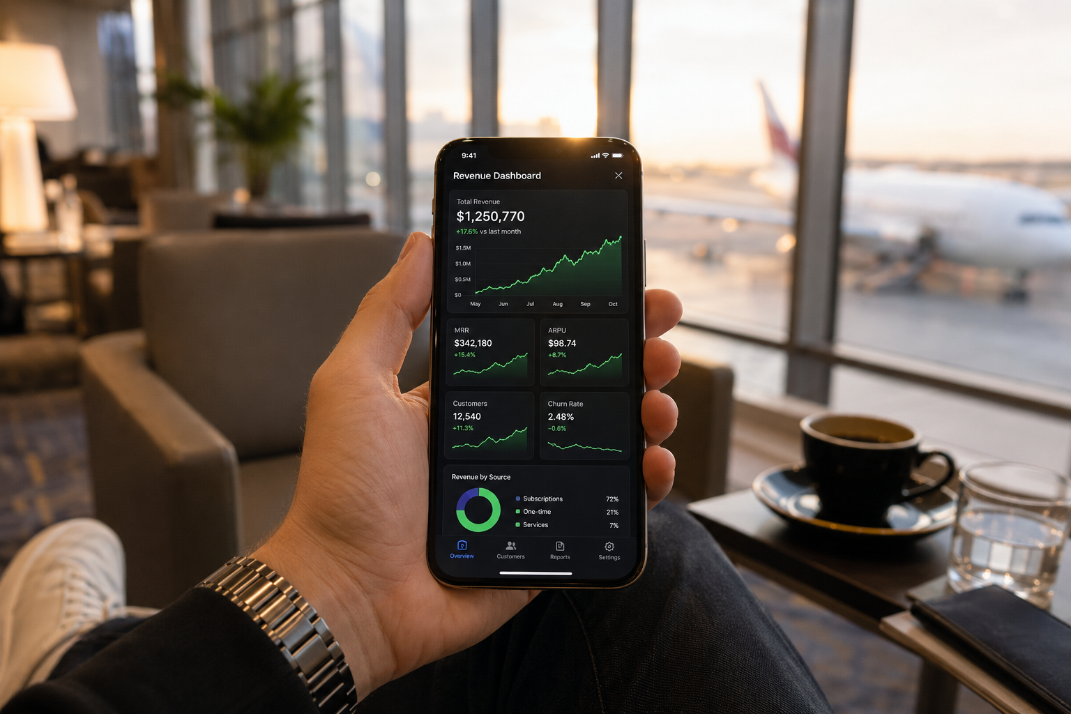 Revenue dashboard on smartphone in luxury lounge